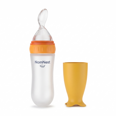 NomNest silicone squeeze baby feeder - orange with yellow cap